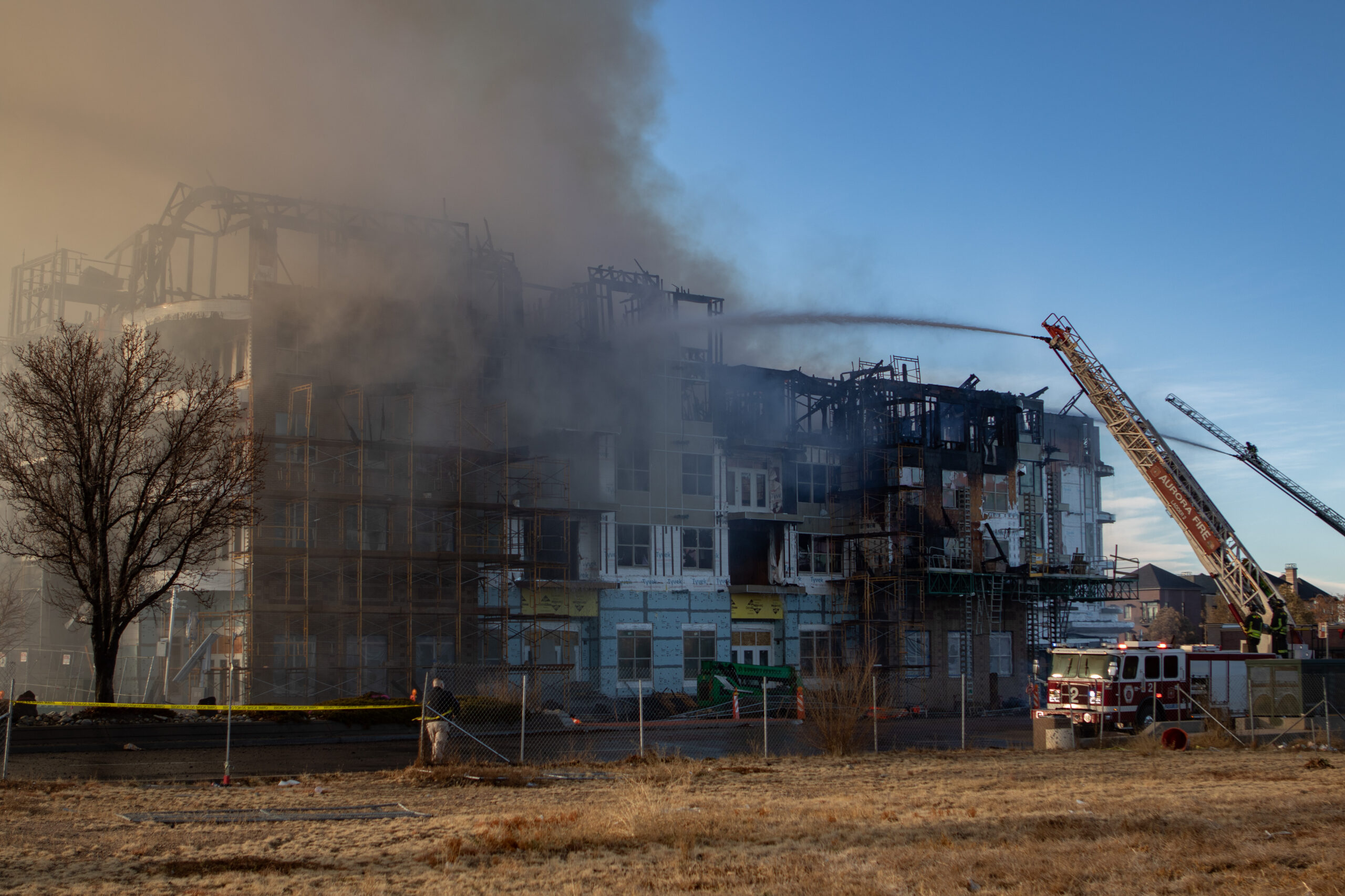 Fire service commanding apartment fire.